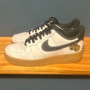 Nike White and Black Sneakers with Gold Accents